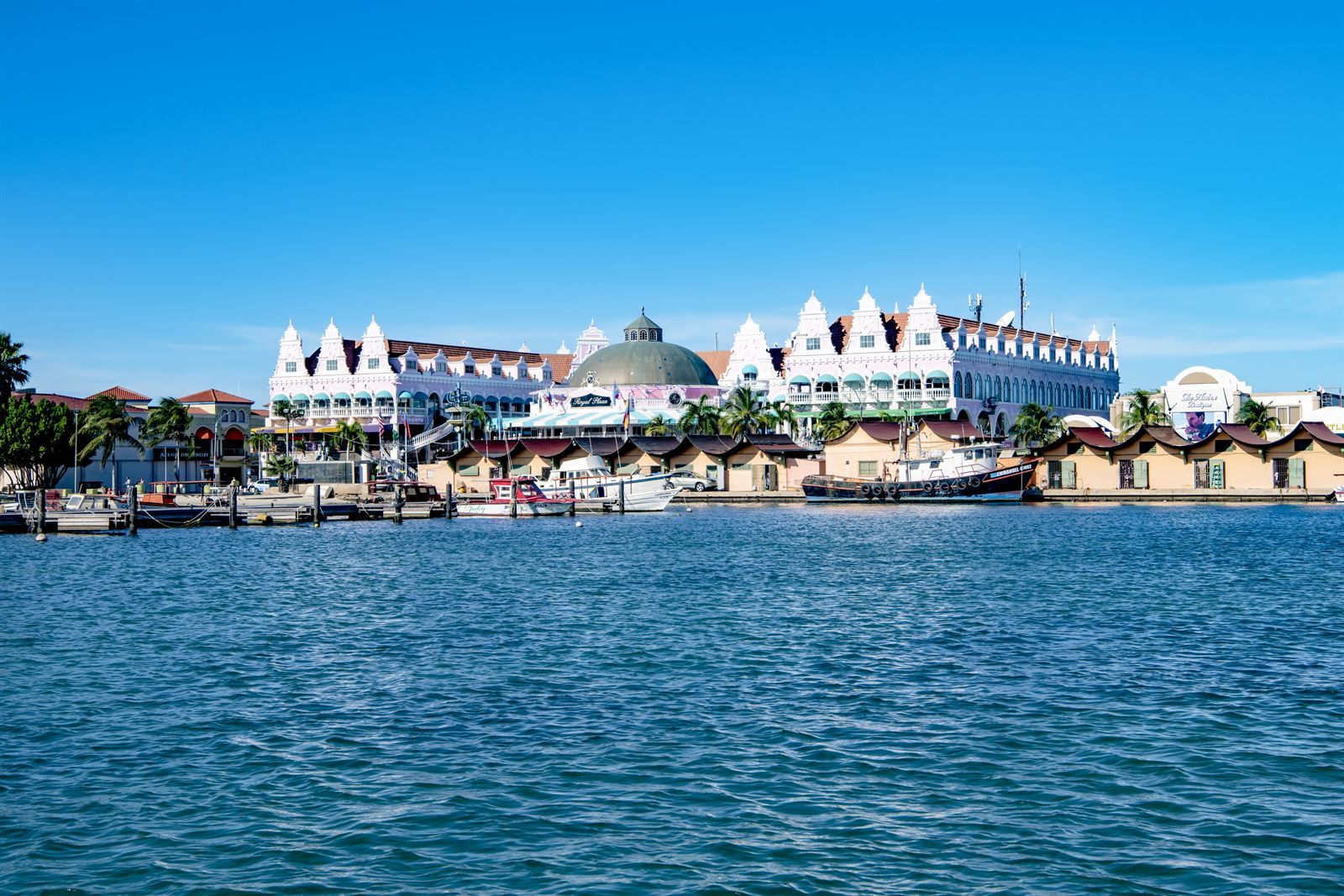 Pastel Dutch-colonial buildings on the Oranjestad waterfront, a stop among things to do in Aruba
